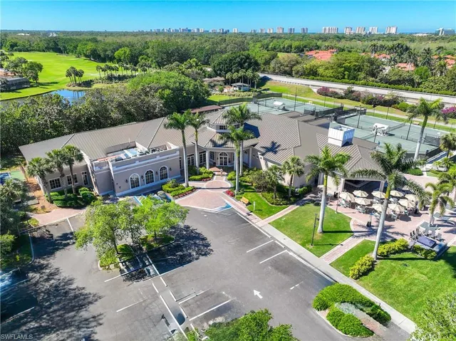 an aerial view of a house with yard swimming pool and outdoor seating