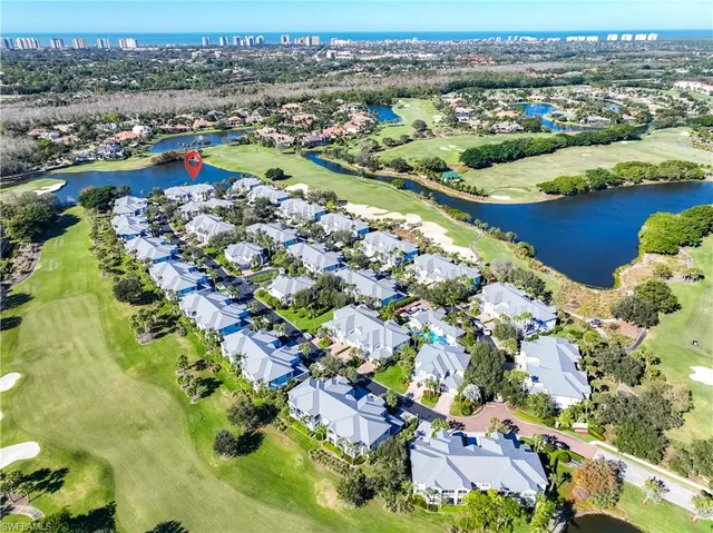 a view of livingroom with hardwood floor and a refrigerator