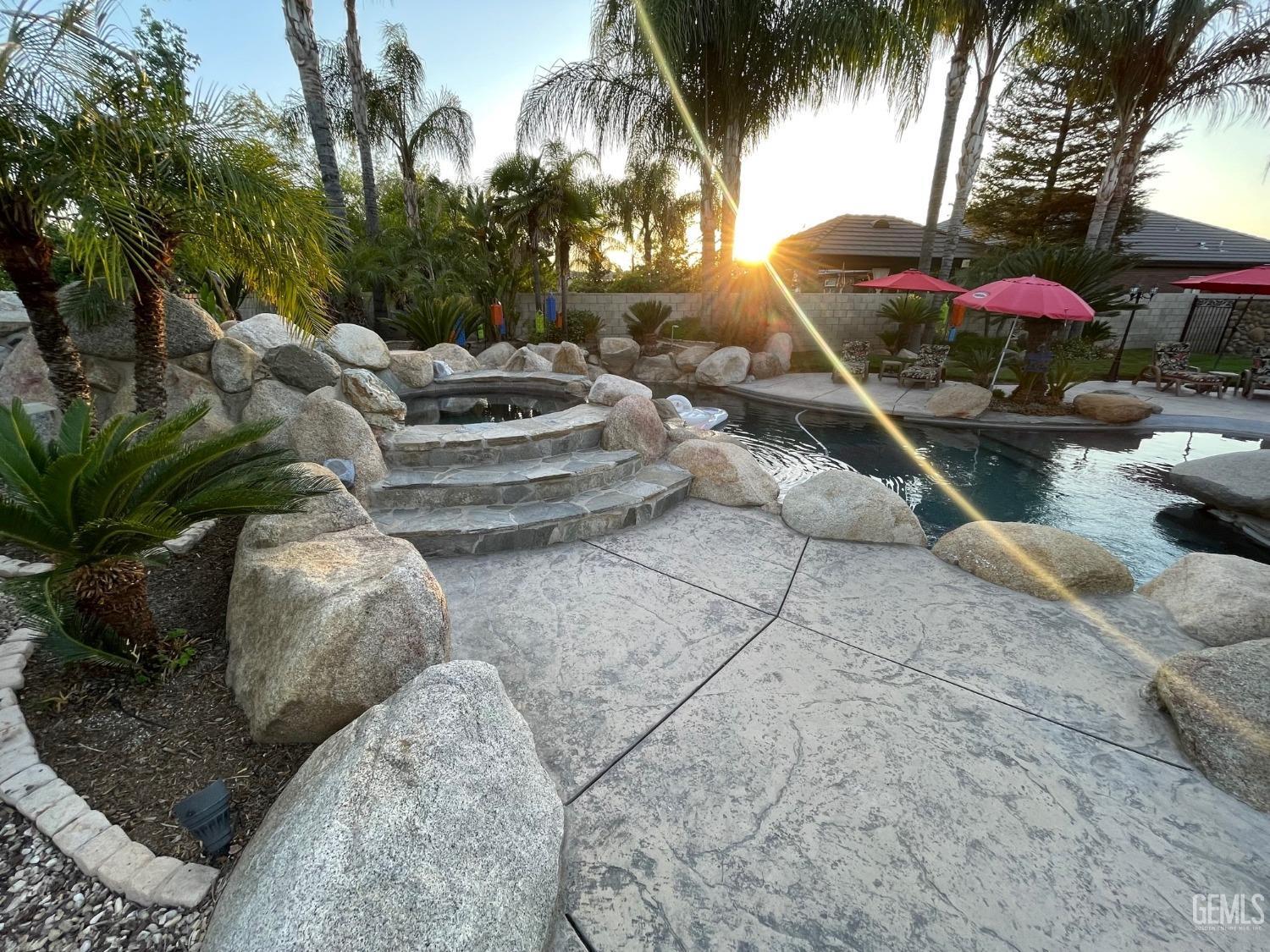 Undisclosed Address Bakersfield, CA 93314 - Photo 16 of 60 a view of a backyard with a patio