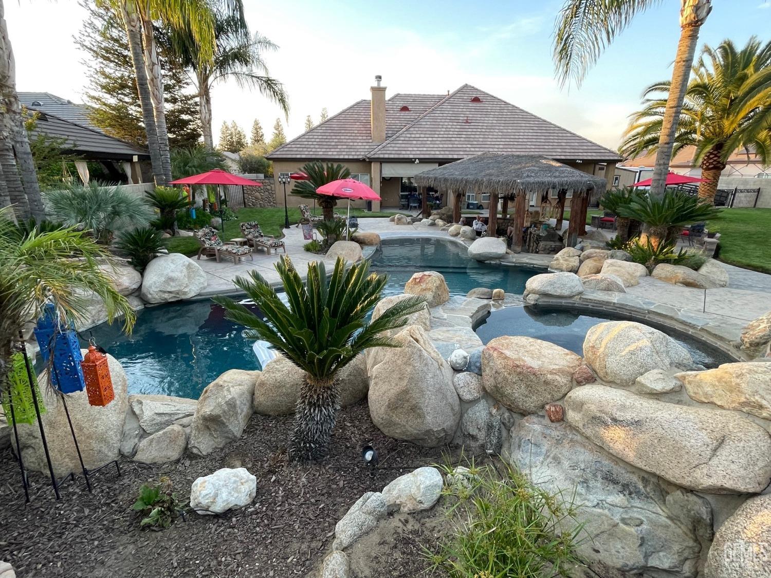 Undisclosed Address Bakersfield, CA 93314 - Photo 17 of 60 a group of people sitting in a yard