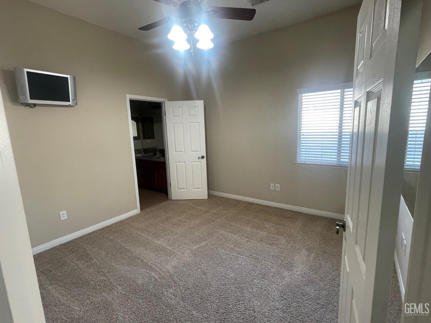 Undisclosed Address Bakersfield, CA 93314 - Photo 41 of 60 an empty room with windows and closet