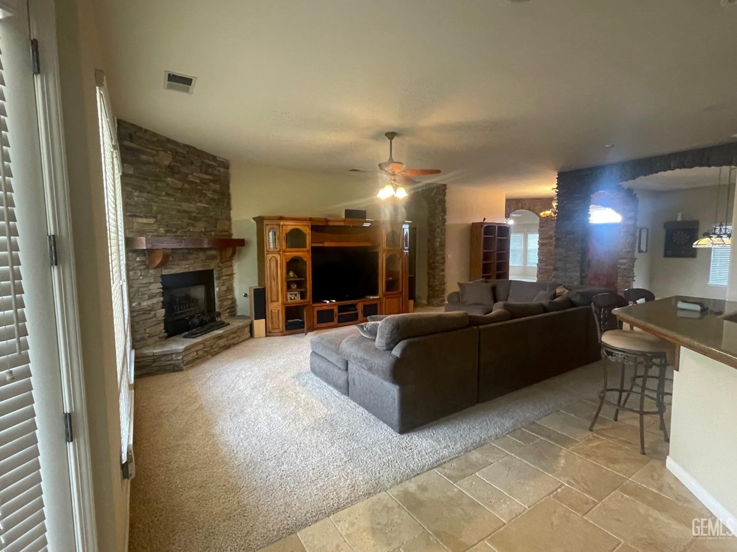 Undisclosed Address Bakersfield, CA 93314 - Photo 52 of 60 a living room with furniture and a fireplace