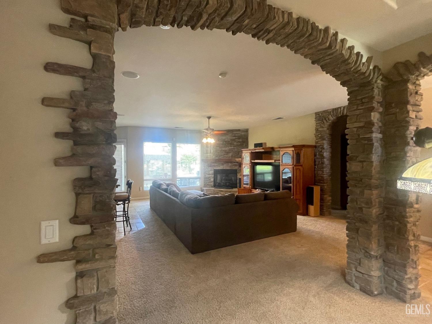 Undisclosed Address Bakersfield, CA 93314 - Photo 53 of 60 a living room with furniture and a fireplace