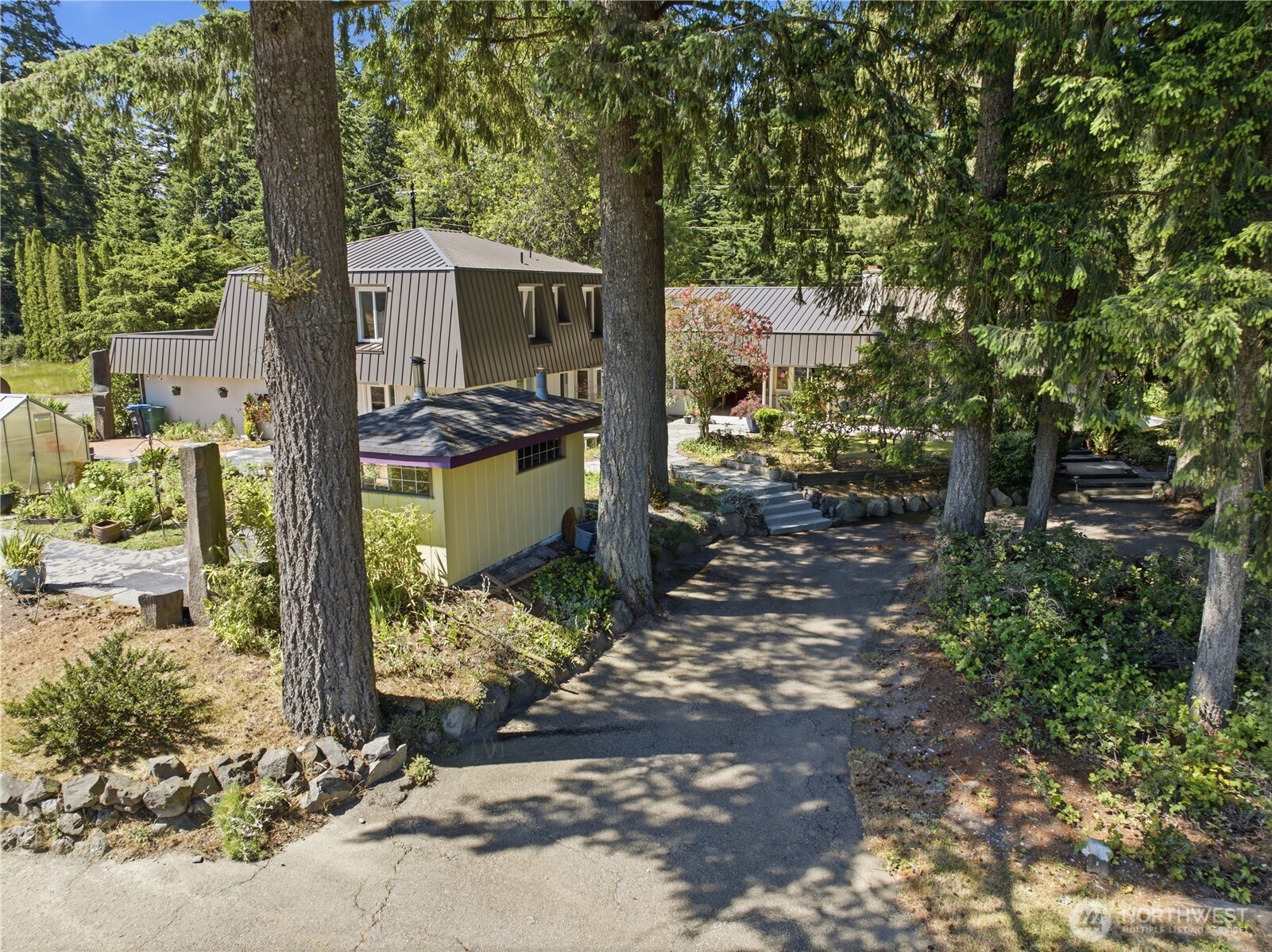 3050 Southeast Mullenix Road Port Orchard, WA 98367 - Photo 30 of 40 a front view of a house with a yard