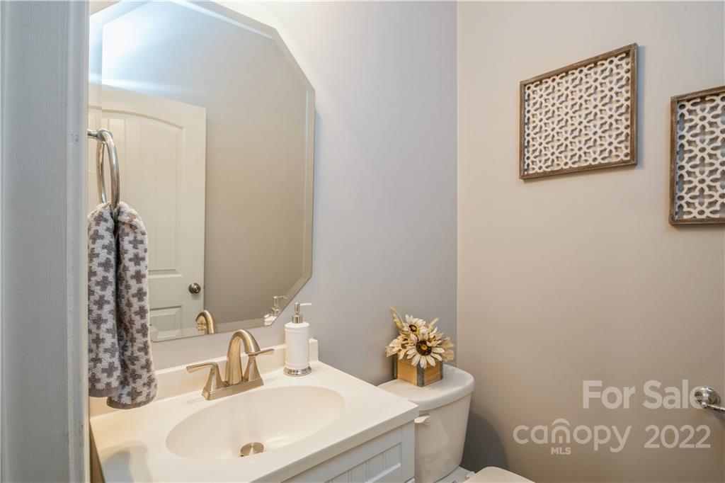 5113 Unionville Road Monroe, NC 28110 - Photo 15 of 43 a bathroom with a sink and a mirror