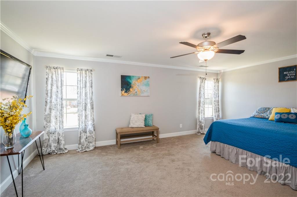 5113 Unionville Road Monroe, NC 28110 - Photo 25 of 43 a bedroom with furniture and windows