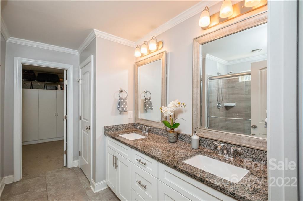 5113 Unionville Road Monroe, NC 28110 - Photo 26 of 43 a bathroom with a granite countertop sink and a mirror