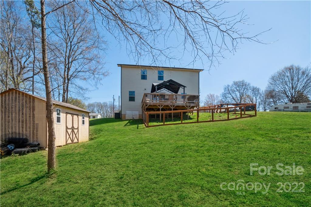 5113 Unionville Road Monroe, NC 28110 - Photo 30 of 43 a view of a house with backyard and porch