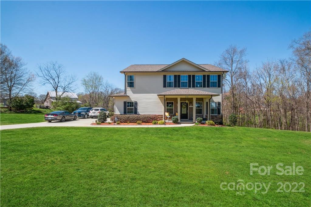 5113 Unionville Road Monroe, NC 28110 - Photo 4 of 43 a front view of a house with a garden