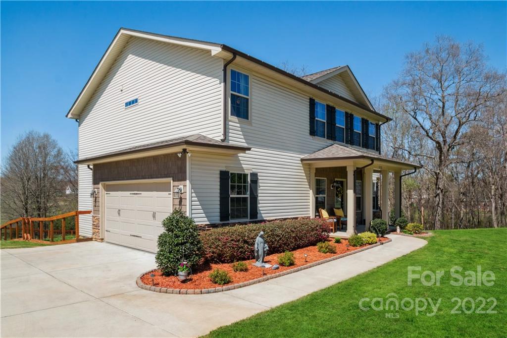 5113 Unionville Road Monroe, NC 28110 - Photo 6 of 43 a front view of a house with a yard