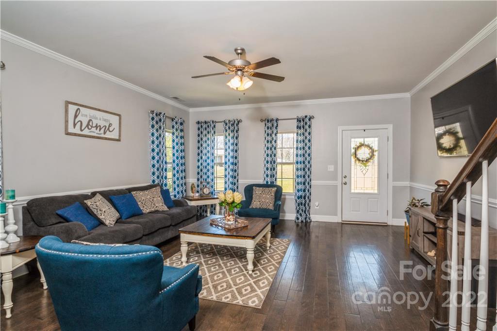 5113 Unionville Road Monroe, NC 28110 - Photo 10 of 43 a living room with furniture and wooden floor