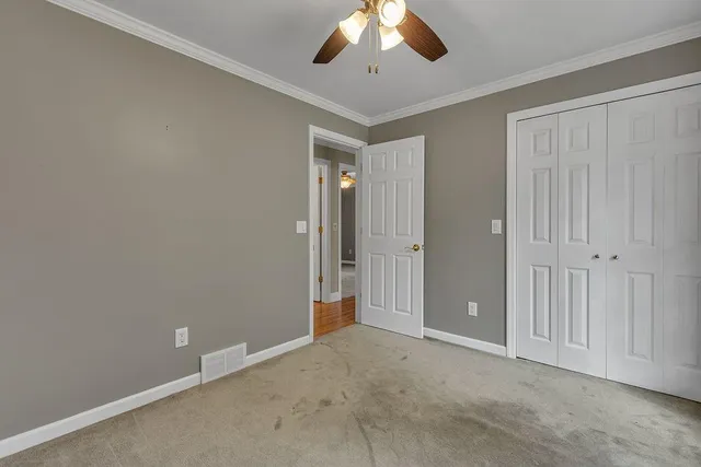 an empty room with a bathroom