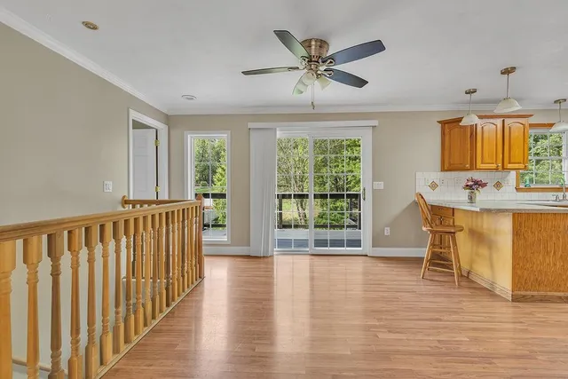 a view of a dining room with furniture window and wooden floor