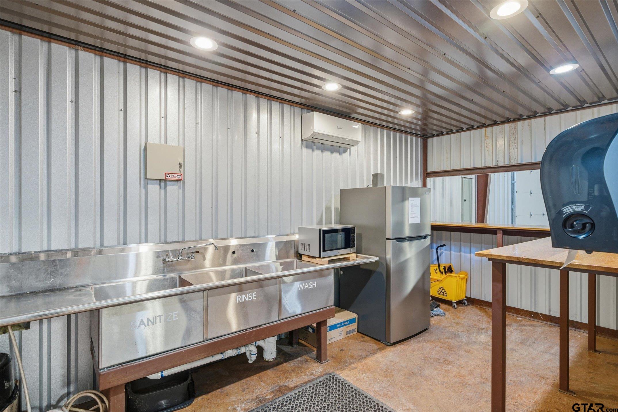 300 Quail Street Van, TX 75790 - Photo 6 of 19 a kitchen with refrigerator and window