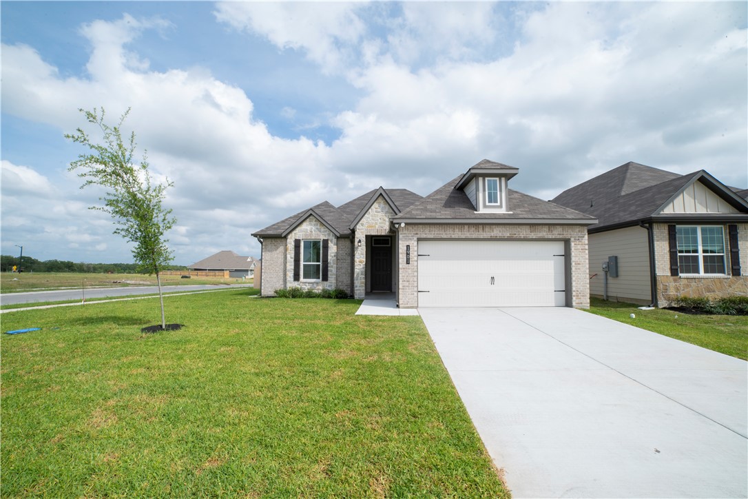 1901 Sebright Drive Bryan, TX 77807 - Photo 1 of 13 a front view of a house with a yard