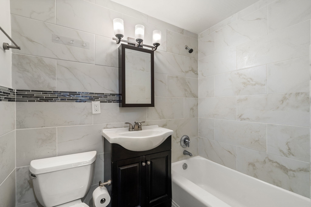167 Beacon Street, Unit 2 Boston, MA 02116 - Photo 12 of 18 a bathroom with a sink a toilet and shower