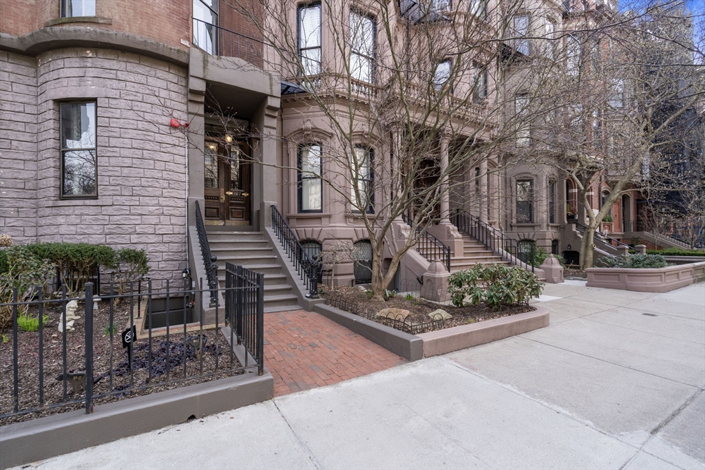 167 Beacon Street, Unit 2 Boston, MA 02116 - Photo 17 of 18 a front view of a house with garden