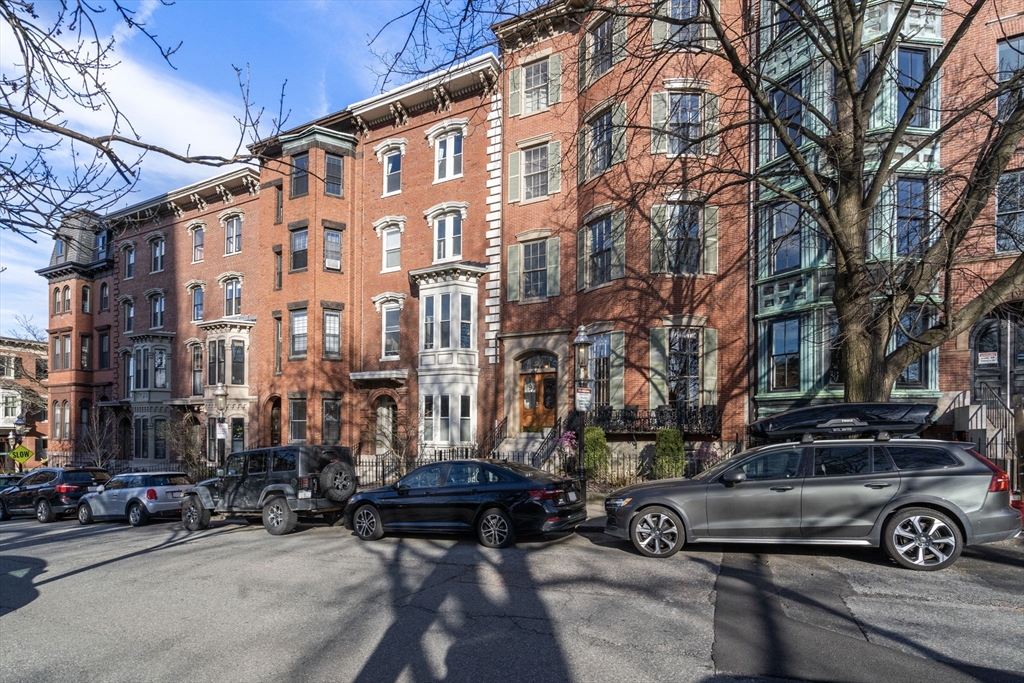 167 Beacon Street, Unit 2 Boston, MA 02116 - Photo 18 of 18 a car parked in front of a building