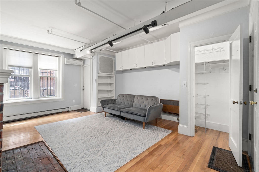 167 Beacon Street, Unit 2 Boston, MA 02116 - Photo 7 of 18 a living room with furniture and a rug