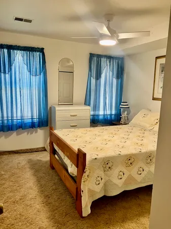 a bathroom with a window and a shower