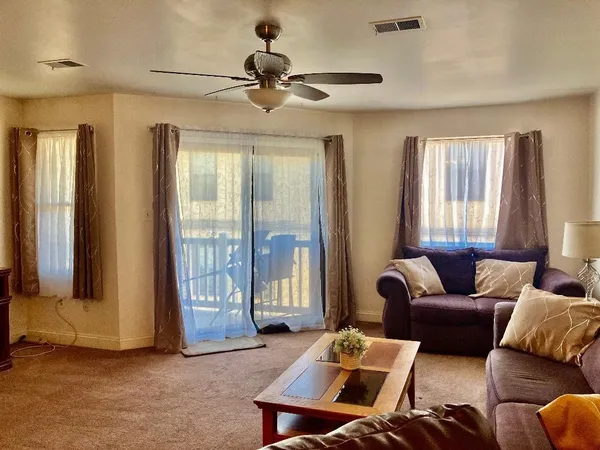 a living room with furniture and a window