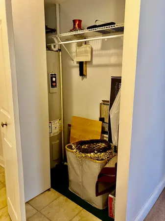 a large bedroom with a bed and a couch