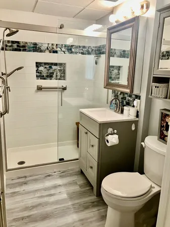 a spacious bedroom with a bed and a dresser