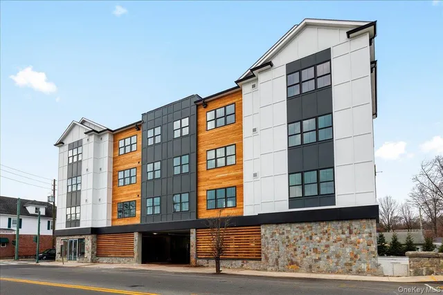 a front view of a building with a street