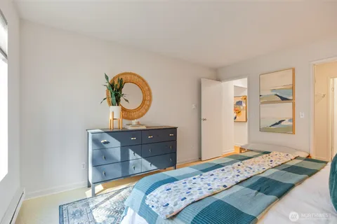 a bathroom with a granite countertop shower and toilet