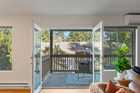 a view of a two chairs in the balcony