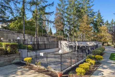 a view of a house with a glass door and tree