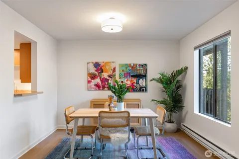 a view of a dining room with furniture window and wooden floor