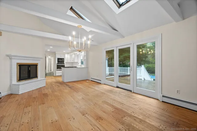 a kitchen with white cabinets and sink