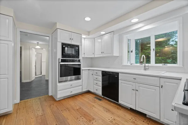 a view of storage and utility room with washer and dryer