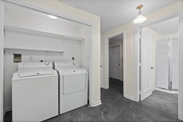 a bathroom with a double vanity sink mirror and