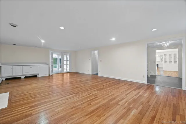 a view of an empty room with a large window