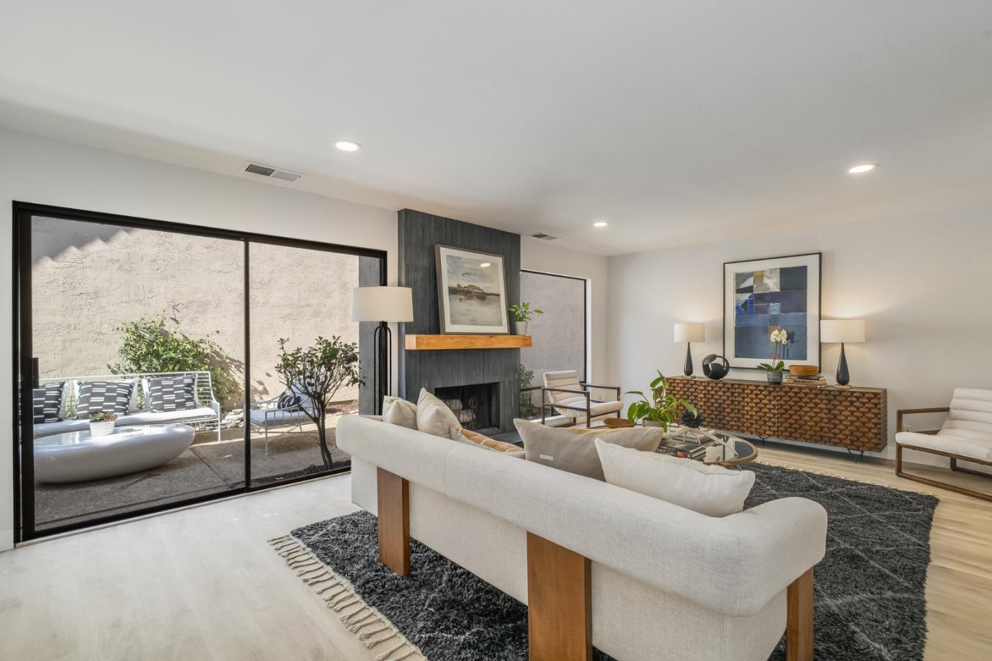 1903 Milano Way Mountain View, CA 94040 - Photo 12 of 48 a living room with furniture large window and a fireplace