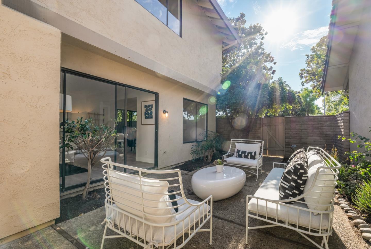 1903 Milano Way Mountain View, CA 94040 - Photo 14 of 48 a view of a patio with table and chairs potted plants and a large tree