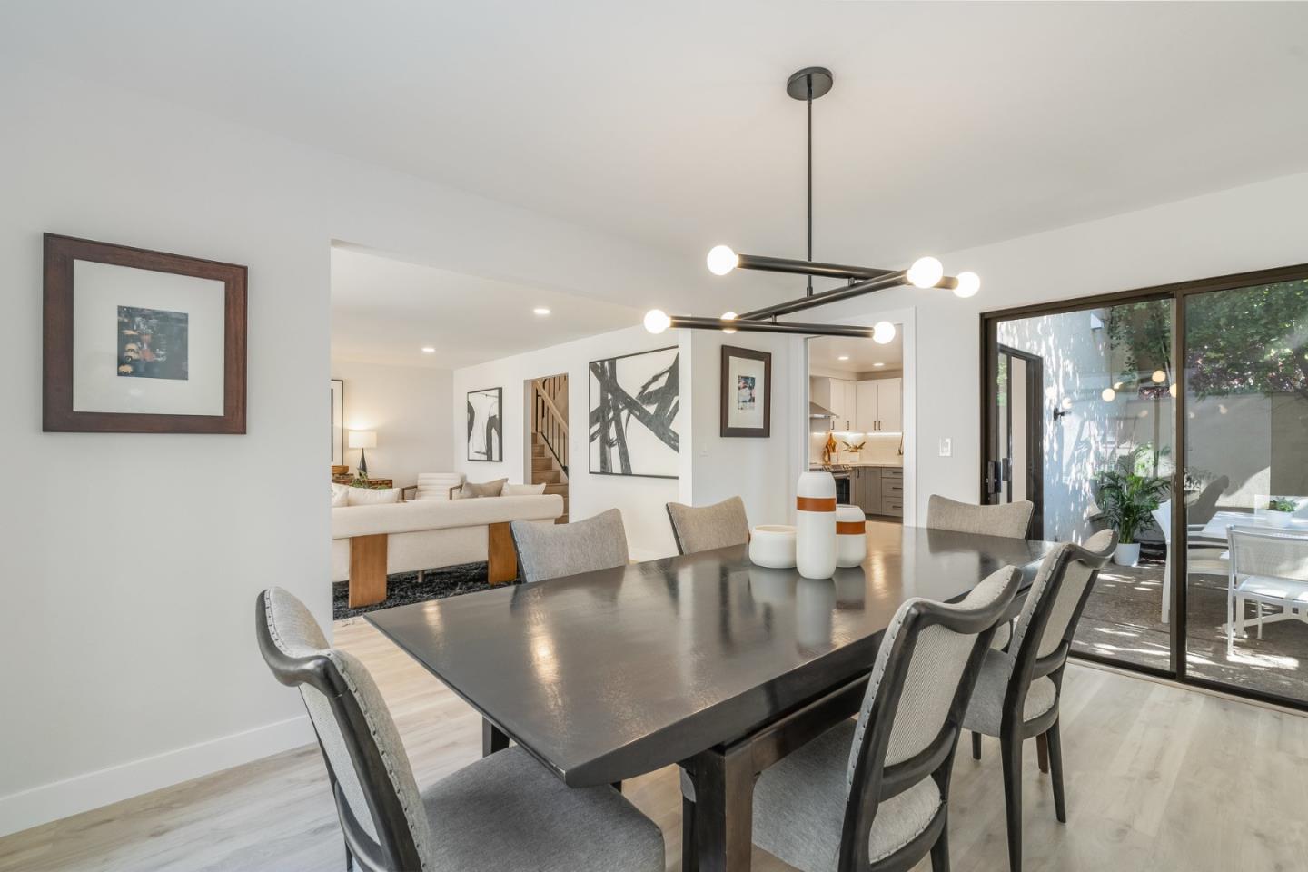 1903 Milano Way Mountain View, CA 94040 - Photo 18 of 48 a view of a dining room and livingroom furniture wooden floor a rug and a chandelier
