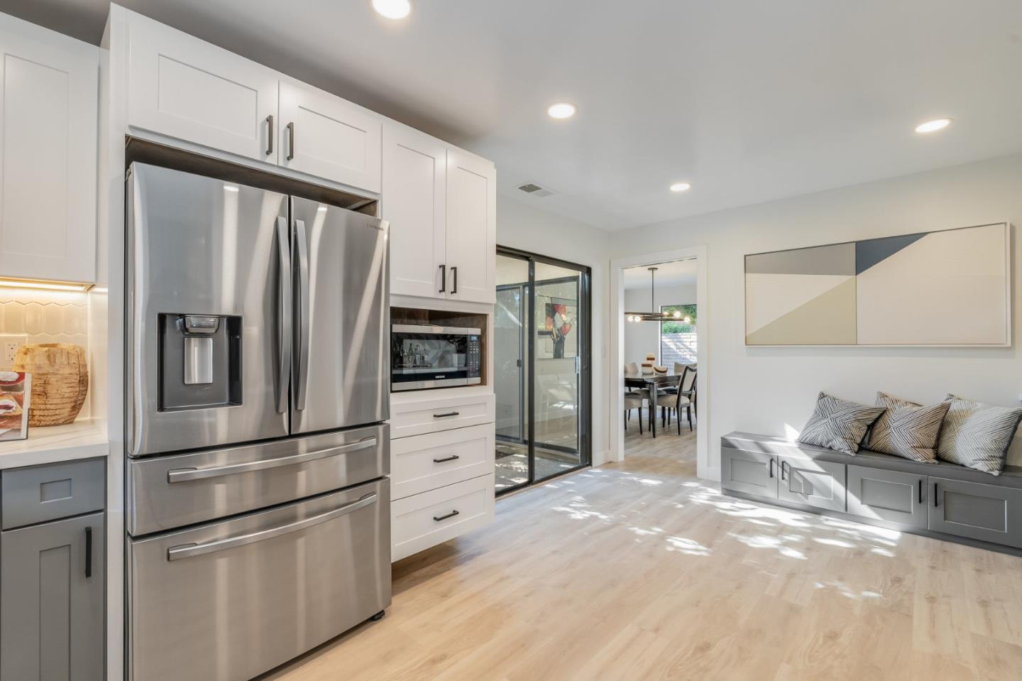1903 Milano Way Mountain View, CA 94040 - Photo 22 of 48 a kitchen with stainless steel appliances a refrigerator and wooden cabinets