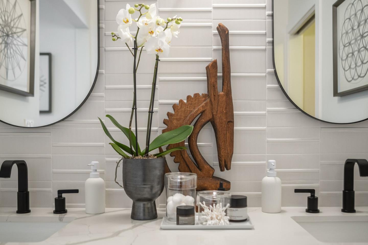 1903 Milano Way Mountain View, CA 94040 - Photo 29 of 48 a vase of flowers sitting on a table with a mirror