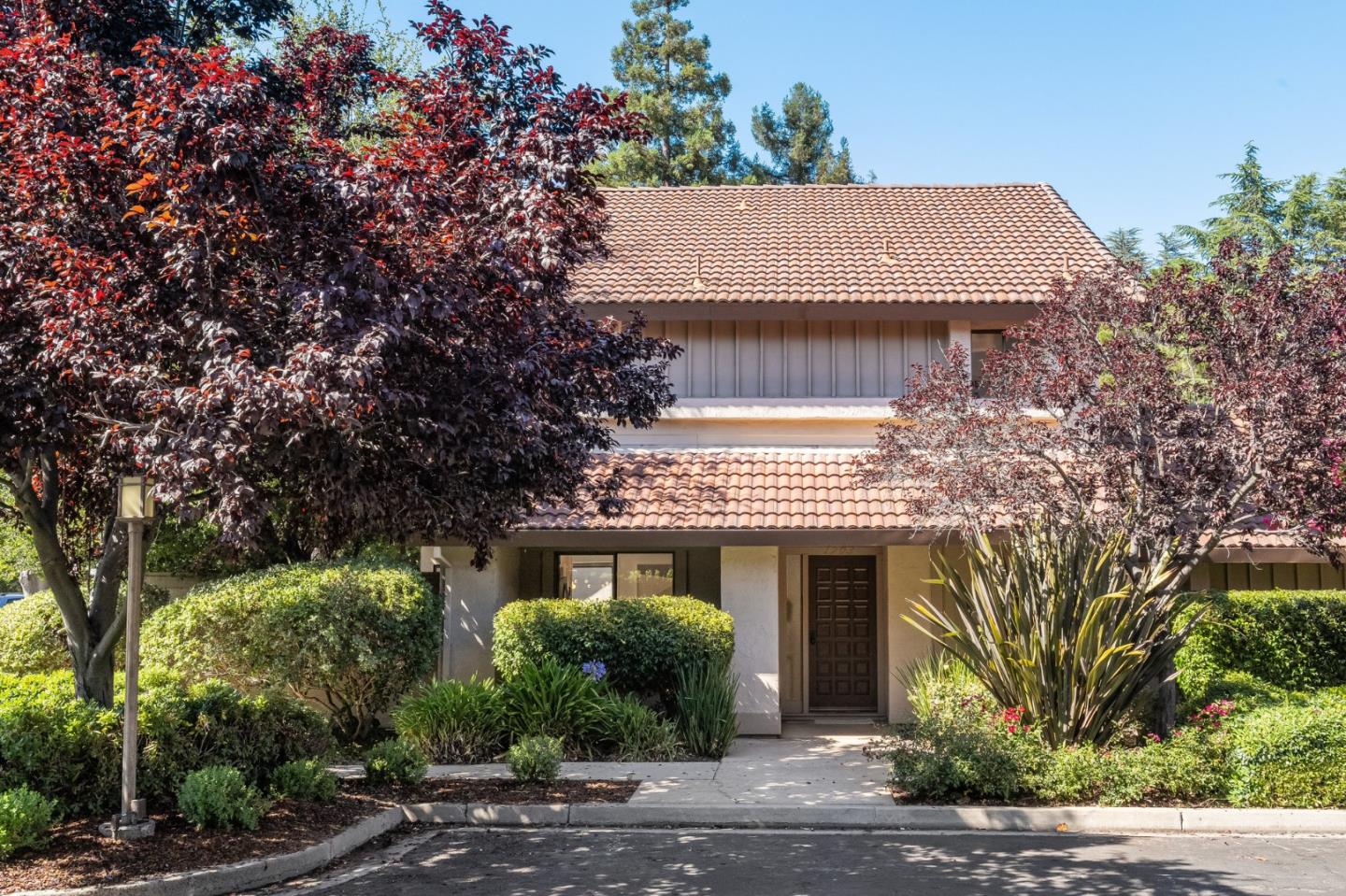 1903 Milano Way Mountain View, CA 94040 - Photo 3 of 48 a front view of a house with a yard and garage