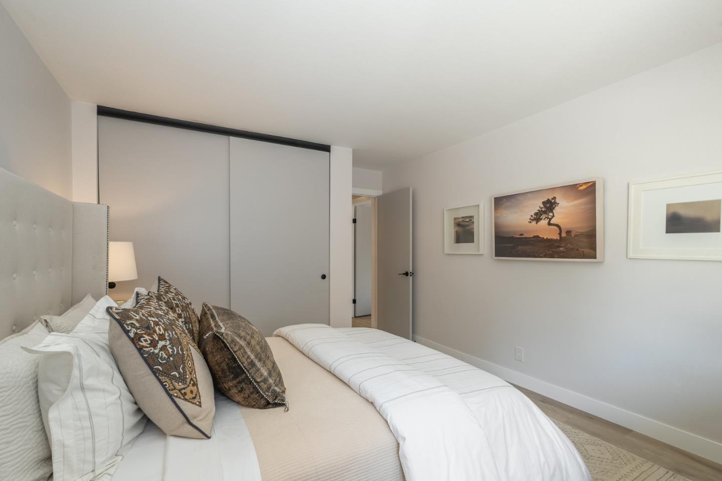 1903 Milano Way Mountain View, CA 94040 - Photo 32 of 48 a bedroom with a bed and a painting on the wall