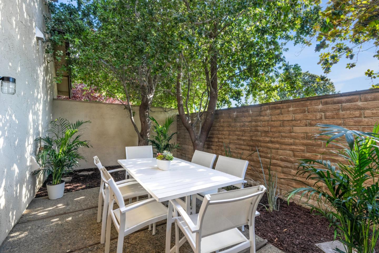 1903 Milano Way Mountain View, CA 94040 - Photo 39 of 48 a view of a patio with table and chairs and potted plants