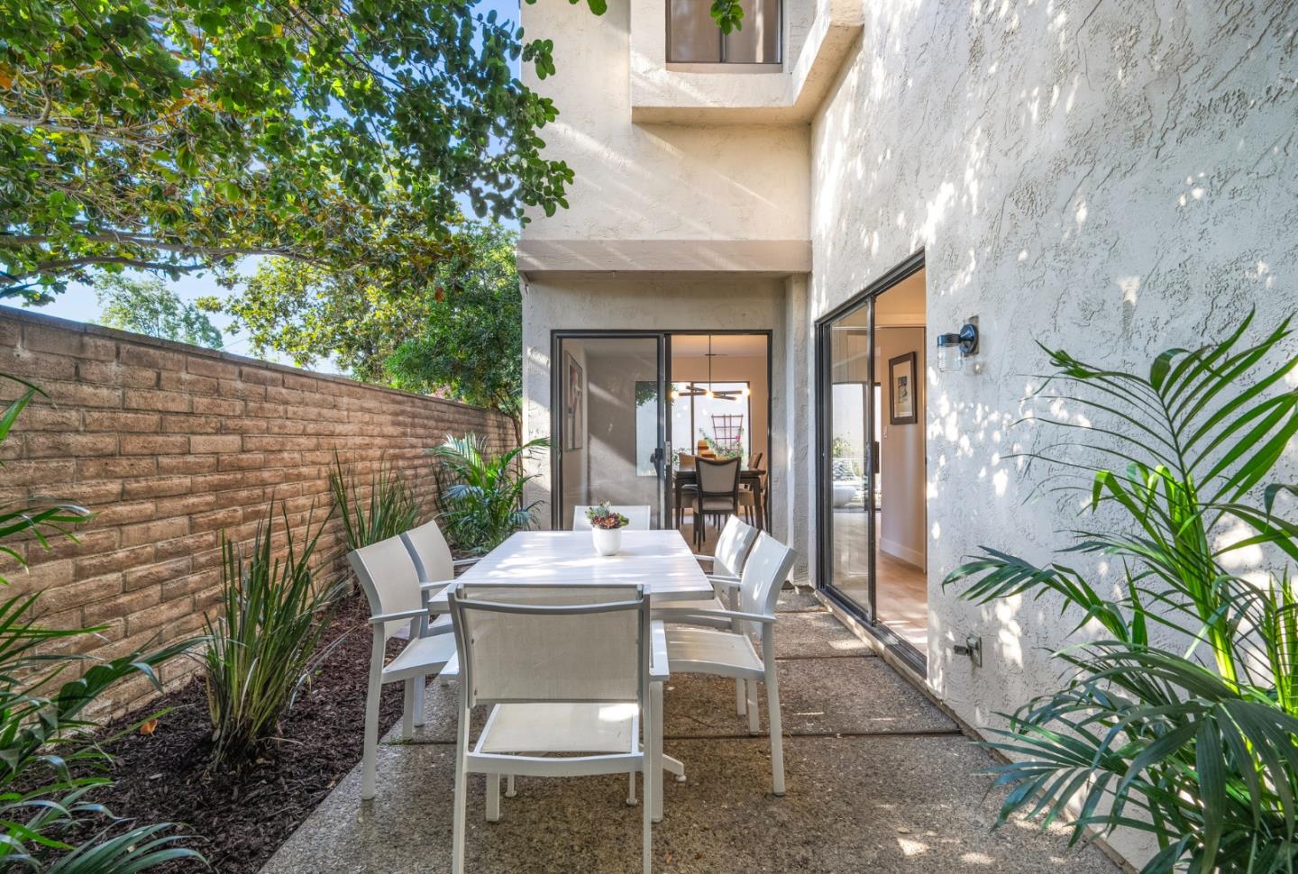 1903 Milano Way Mountain View, CA 94040 - Photo 40 of 48 a view of a patio with table and chairs and potted plants