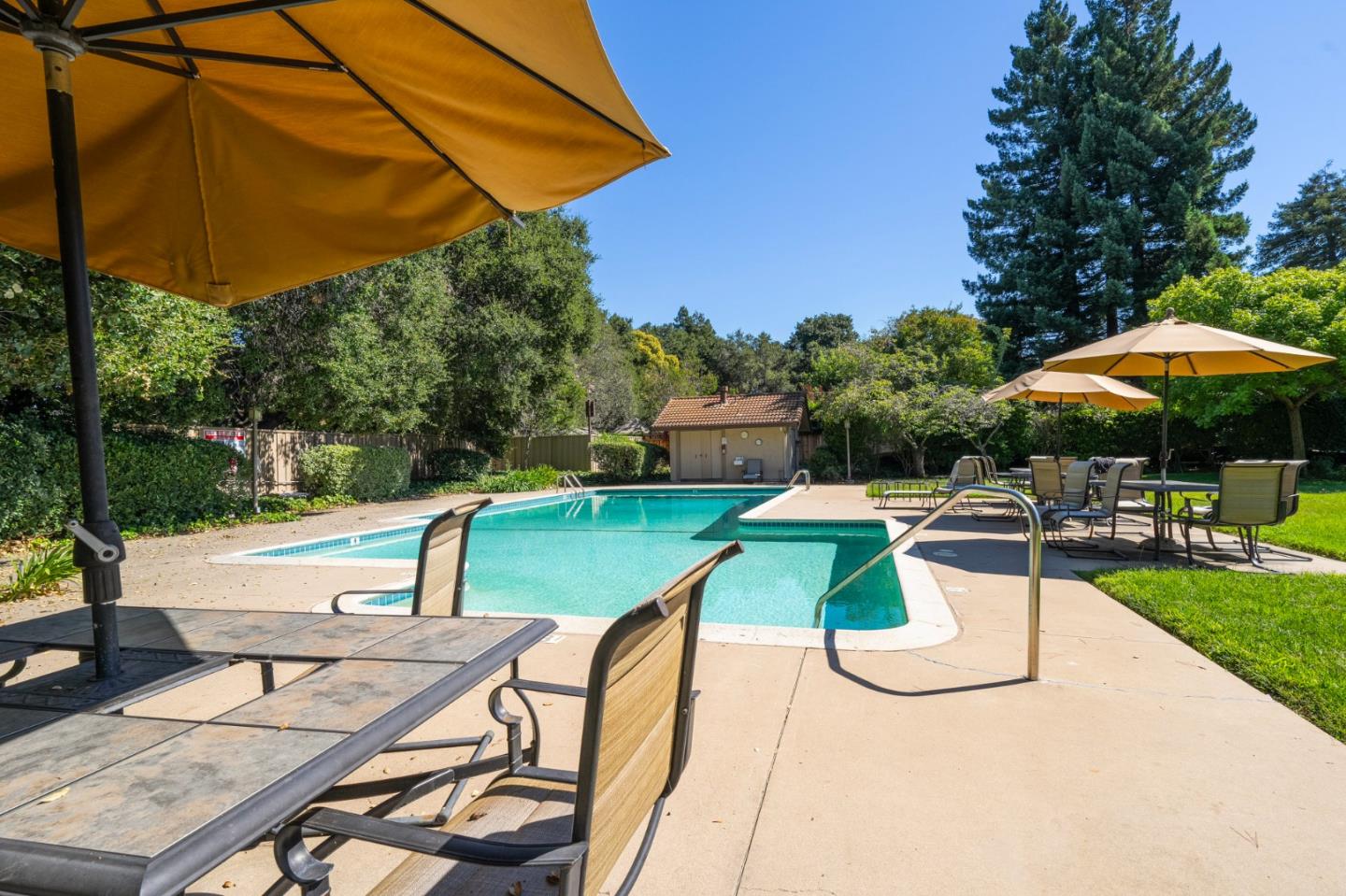 1903 Milano Way Mountain View, CA 94040 - Photo 47 of 48 a view of a patio with a table and chairs under an umbrella