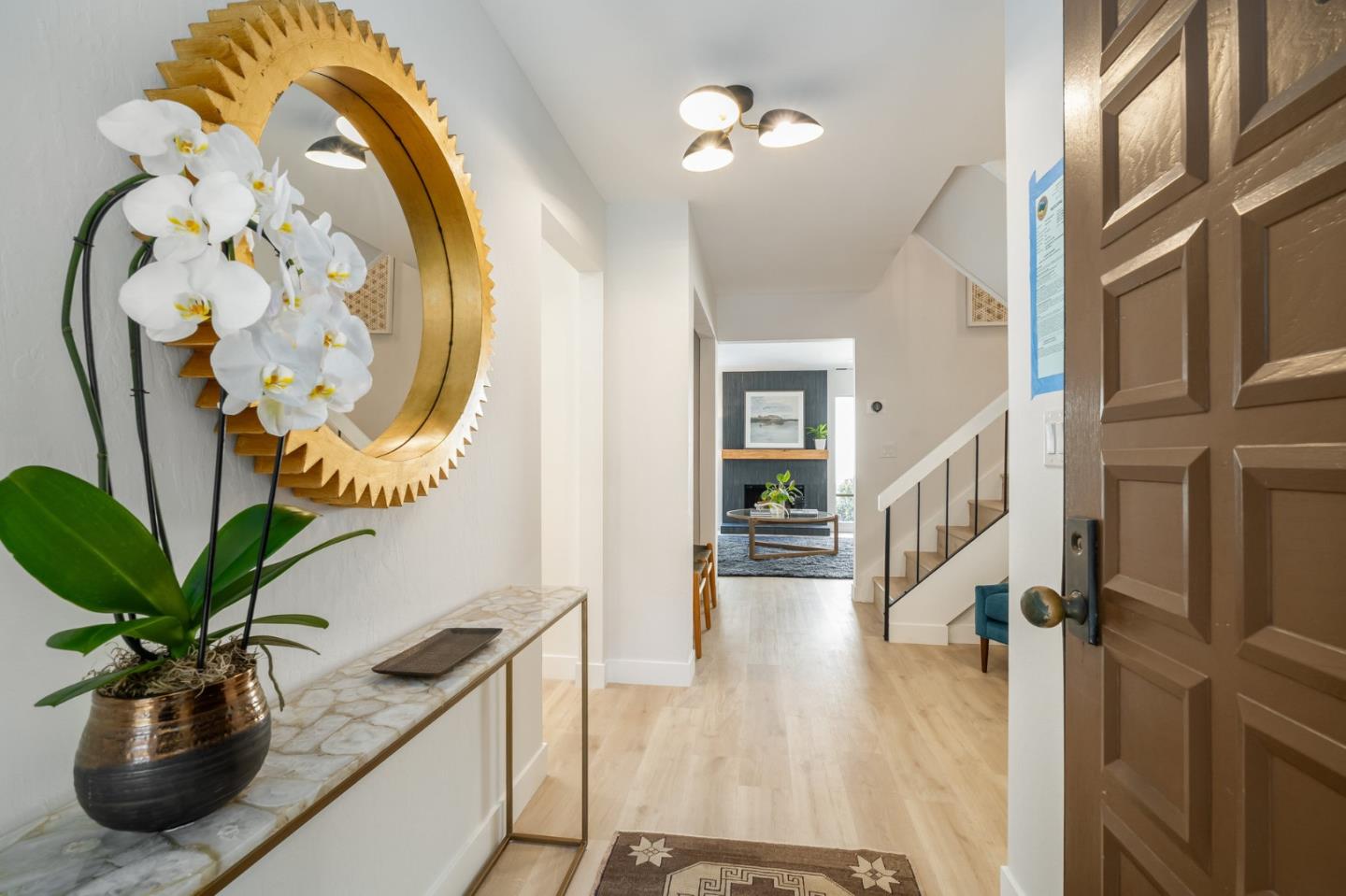 1903 Milano Way Mountain View, CA 94040 - Photo 7 of 48 a view of a hallway with wooden floor and a chandelier
