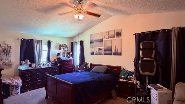 2478 KOA Drive Rialto, CA 92377 - Photo 10 of 18 a bedroom with a bed and a chandelier