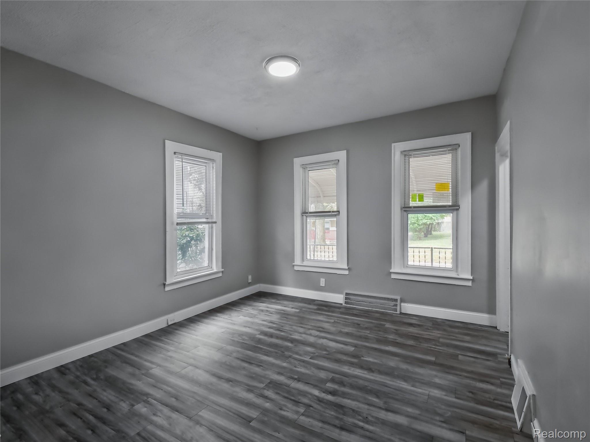 8220 Hudson Avenue Warren, MI 48089 - Photo 4 of 28 Unfurnished room with dark wood-type flooring and baseboards