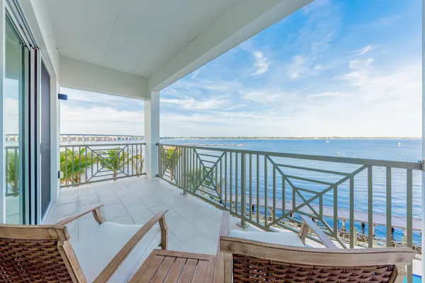 a view of a balcony with chairs